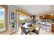 Cozy breakfast nook next to the kitchen, featuring a round table and access to an outdoor deck at 1647 Harris Ct, Erie, CO 80516