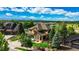 Beautiful home boasts mature trees, lush lawn, a three car garage, and lovely landscaping at 1647 Harris Ct, Erie, CO 80516