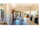 Inviting foyer features tile flooring, an open floorplan, and a view into the adjacent office space at 1647 Harris Ct, Erie, CO 80516