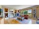 Cozy living room features a fireplace, built-in shelving, large windows and lots of natural light at 1647 Harris Ct, Erie, CO 80516