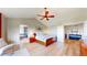 Well lit main bedroom features an attached bathroom and closet, and wood floors at 1647 Harris Ct, Erie, CO 80516