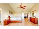 Spacious main bedroom featuring a vaulted ceiling and warm hardwood floors at 1647 Harris Ct, Erie, CO 80516