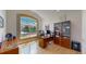 Bright home office with a large window that provides plenty of natural light and views of the neighborhood at 1647 Harris Ct, Erie, CO 80516