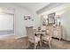 Dining area with seating for four and traditional buffet at 10056 W Unser Dr # 102, Littleton, CO 80127