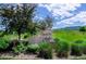 Chatfield Bluffs neighborhood entrance sign surrounded by lush greenery at 10056 W Unser Dr # 102, Littleton, CO 80127