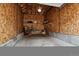 Spacious garage interior with shelving, bicycle, and ample storage area at 10056 W Unser Dr # 102, Littleton, CO 80127