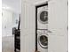 Convenient in-unit laundry closet with stacked washer and dryer at 10056 W Unser Dr # 102, Littleton, CO 80127