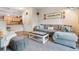 Comfortable living room featuring plush seating, stylish decor, and ample natural light at 10056 W Unser Dr # 102, Littleton, CO 80127