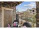 Cozy patio with stone accents, outdoor seating, and views of the surrounding community at 10056 W Unser Dr # 102, Littleton, CO 80127