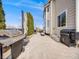 Outdoor patio with stone pavers, built-in grill, lush landscaping, and comfortable outdoor seating area at 14711 Detroit Way, Thornton, CO 80602