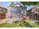 Exterior shot of home with large backyard, patio, grill, and game area at 277 S Gilpin St, Denver, CO 80209