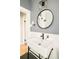 Chic bathroom featuring wainscoting, a modern sink, and stylish mirror at 277 S Gilpin St, Denver, CO 80209