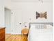 Comfortable bedroom with hardwood floors and mountain view art at 277 S Gilpin St, Denver, CO 80209