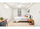 Cozy bedroom features plush carpeting, built-in shelving, and a comfortable bed at 277 S Gilpin St, Denver, CO 80209