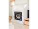 Close-up of living room fireplace with hardwood floors and bright light at 277 S Gilpin St, Denver, CO 80209