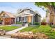 Charming home with a craftsman-style front exterior and a well-manicured lawn and stone landscaping at 277 S Gilpin St, Denver, CO 80209