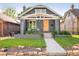 Charming home with a craftsman-style front exterior and a well-manicured lawn and stone landscaping at 277 S Gilpin St, Denver, CO 80209