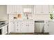 This kitchen boasts white cabinets, stainless steel appliances, and sleek countertops at 277 S Gilpin St, Denver, CO 80209
