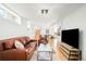Spacious living room featuring a large screen TV and open floor plan at 277 S Gilpin St, Denver, CO 80209