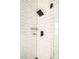 Modern shower featuring white subway tile and sleek black fixtures at 277 S Gilpin St, Denver, CO 80209