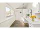Sunroom with large window, countertop workstation, and colorful tiled floor at 277 S Gilpin St, Denver, CO 80209