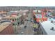 A street view looking down the road between multiple buildings in a thriving downtown area at 5320 Allison St # 202, Arvada, CO 80002