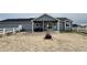 Wide backyard featuring a fire pit, patio, and a mix of gravel and open space at 14545 Barksdaly Way, Keenesburg, CO 80643