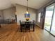 Open dining area with hardwood floors, vaulted ceilings, and direct access to the back patio, great for entertaining at 14545 Barksdaly Way, Keenesburg, CO 80643
