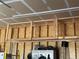 Garage interior features built-in ceiling storage for organizing belongings at 14545 Barksdaly Way, Keenesburg, CO 80643