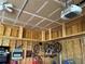 Spacious garage interior with ceiling storage and hanging bike storage at 14545 Barksdaly Way, Keenesburg, CO 80643