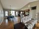 Spacious living room with dining area, view of the kitchen, and comfortable reclining seating at 14545 Barksdaly Way, Keenesburg, CO 80643