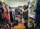 Spacious walk-in closet with shelving and ample space for storage of clothes and accessories at 14545 Barksdaly Way, Keenesburg, CO 80643
