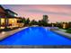 Backyard featuring a sparkling blue pool, hot tub, patio, and inviting lounge areas at 3749 White Bay Dr, Highlands Ranch, CO 80126