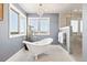Bright bathroom featuring a standalone tub with stylish fixtures and a glass enclosed shower at 3749 White Bay Dr, Highlands Ranch, CO 80126