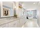 A spacious bathroom includes marble counters, a standalone tub, and a private walk-in closet at 3749 White Bay Dr, Highlands Ranch, CO 80126