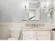 Stylish bathroom featuring a marble vanity, elegant lighting, and modern fixtures at 3749 White Bay Dr, Highlands Ranch, CO 80126