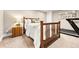 Well-lit bedroom with a wooden bed frame, carpet, and a small side table at 3749 White Bay Dr, Highlands Ranch, CO 80126
