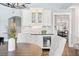 Dining area features built-in bar area with marble backsplash, seating and wine storage at 3749 White Bay Dr, Highlands Ranch, CO 80126