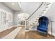 Inviting foyer featuring a staircase, hardwood floors, and a glimpse into the dining room at 3749 White Bay Dr, Highlands Ranch, CO 80126