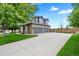 Charming two-story home with a three car garage and a basketball hoop in the driveway at 3749 White Bay Dr, Highlands Ranch, CO 80126