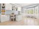 Bright home office with custom built-ins, a bay window, and neutral tones at 3749 White Bay Dr, Highlands Ranch, CO 80126
