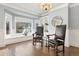 Cozy sitting area with custom shelving, bay window, and decorative lighting fixtures at 3749 White Bay Dr, Highlands Ranch, CO 80126