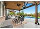 Covered patio with outdoor dining area, pool and backyard views at 3749 White Bay Dr, Highlands Ranch, CO 80126