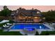 Stunning backyard with a pool, hot tub, and outdoor seating area, perfect for entertaining at 3749 White Bay Dr, Highlands Ranch, CO 80126