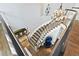 Elegant staircase with wrought iron railings and hardwood steps, leading to the upper level at 3749 White Bay Dr, Highlands Ranch, CO 80126