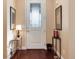 Inviting entryway featuring a decorative glass door, hardwood floors and stylish decor at 16 Willowcroft Dr, Littleton, CO 80123