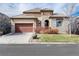 Charming home with a stone facade, tiled roof, two-car garage and manicured landscaping at 16 Willowcroft Dr, Littleton, CO 80123