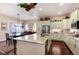 Bright kitchen boasts a large island with granite countertops and stainless steel appliances at 16 Willowcroft Dr, Littleton, CO 80123
