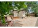 This backyard features a small building, garden beds, and patio stones at 3790 W 54Th Ave, Denver, CO 80221