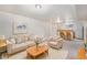 Finished basement with a relaxing living space and adjacent bar area at 3790 W 54Th Ave, Denver, CO 80221